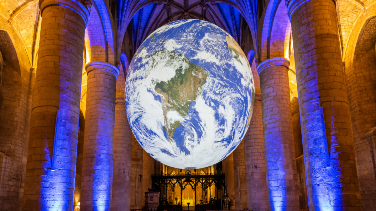 A 23-foot Earth floats free inside a NYC cathedral until Oct. 8