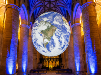 A 23-foot Earth floats free inside a NYC cathedral until Oct. 8