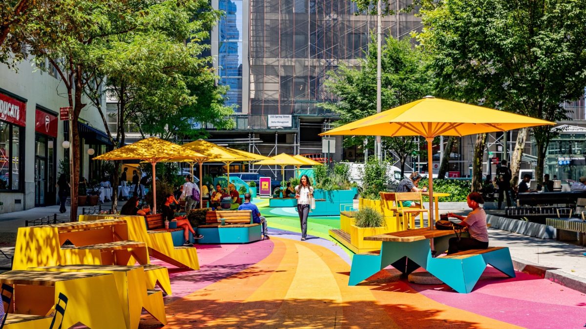 Car-free plaza with a painted street mural joins Spring Street Park in Hudson Square