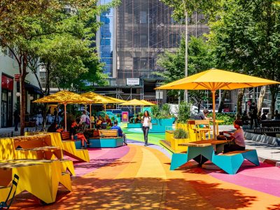 Car-free plaza with a painted street mural joins Spring Street Park in Hudson Square