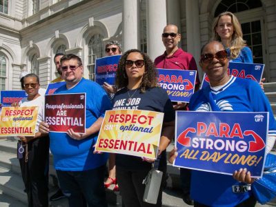 Council fights in court to keep $10,000 checks for school aides alive