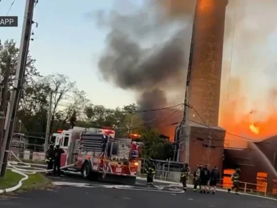 Fire guts empty Mount Loretto warehouse in Pleasant Plains as crews shield historic church