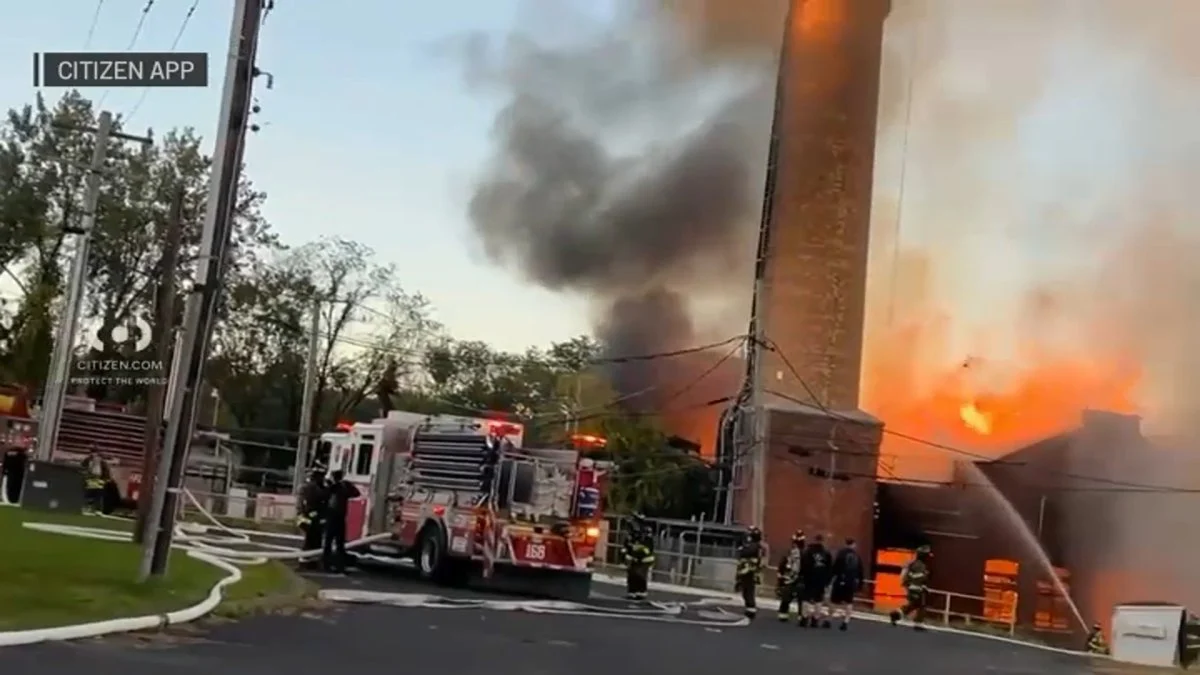 Fire guts empty Mount Loretto warehouse in Pleasant Plains as crews shield historic church