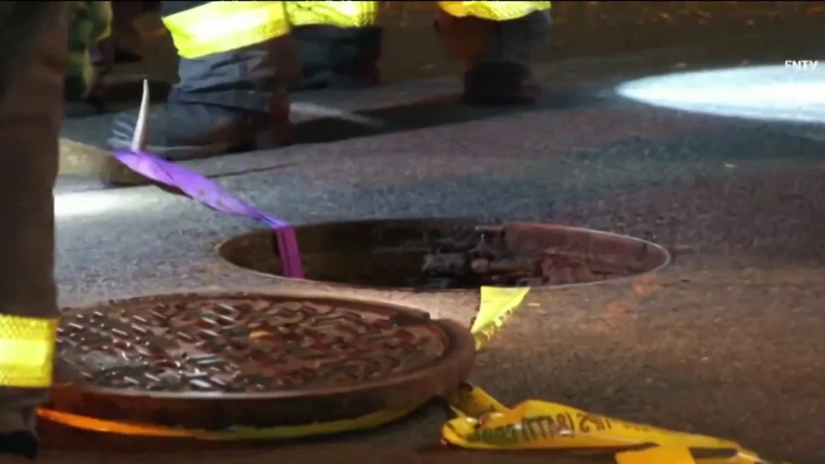Caller reports three men slipping into the sewer at 1 a.m. in Hamilton Heights